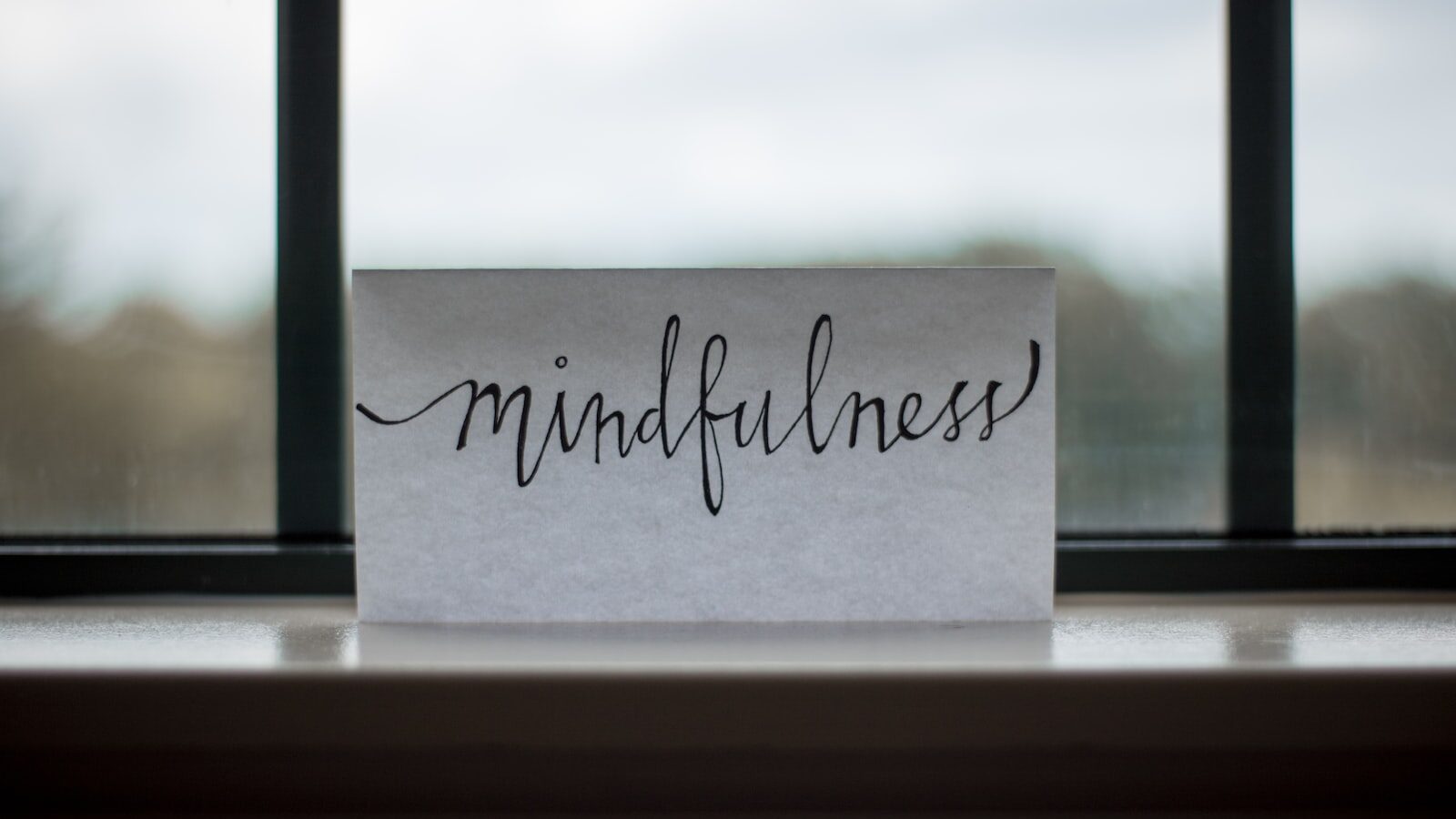 mindfulness printed paper near window